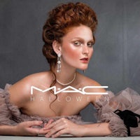 a woman in a dress is posing for the mac halloween ad